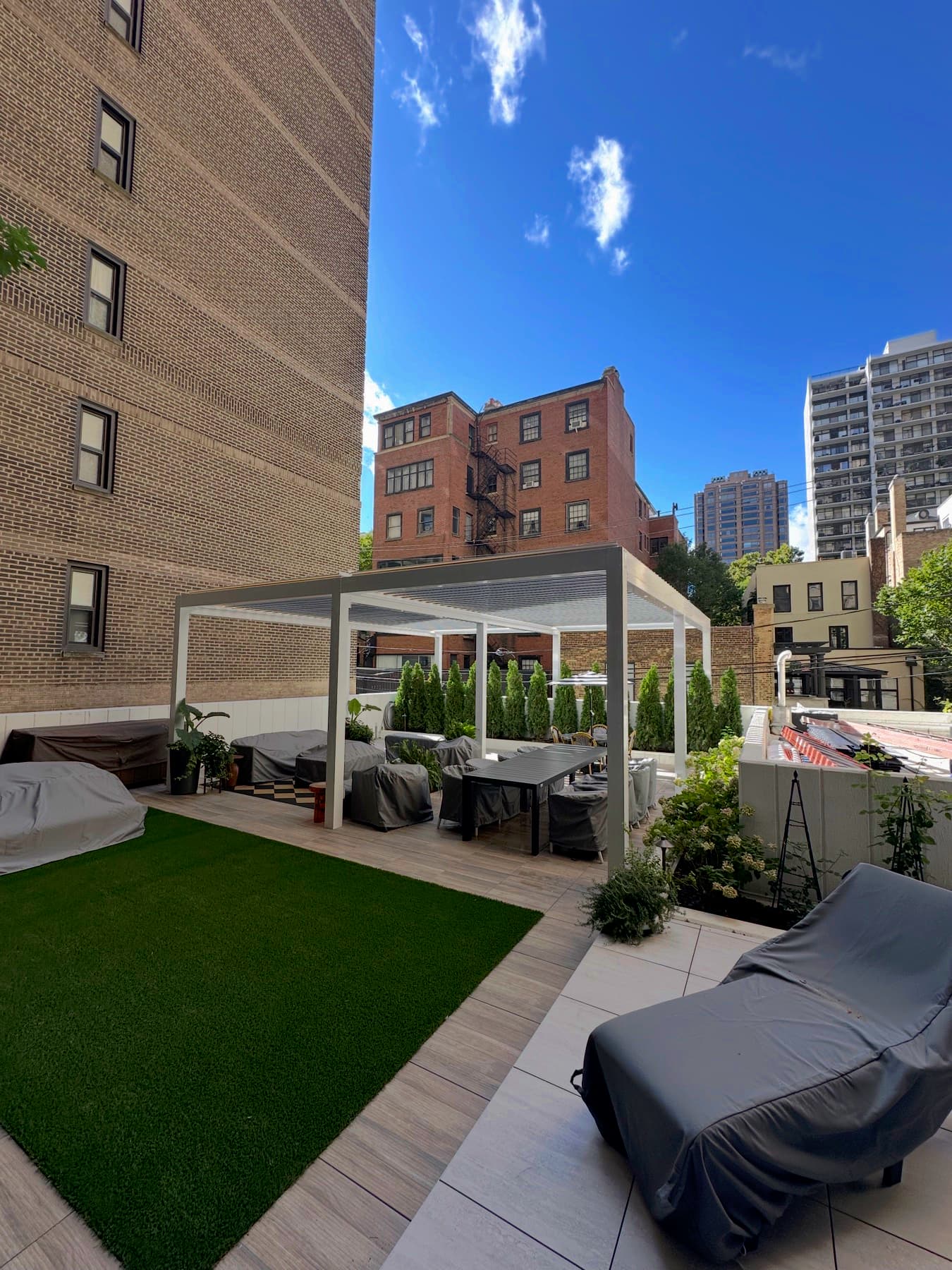 Real Chicago courtyard pergola showing city-lot proportions and surrounding buildings