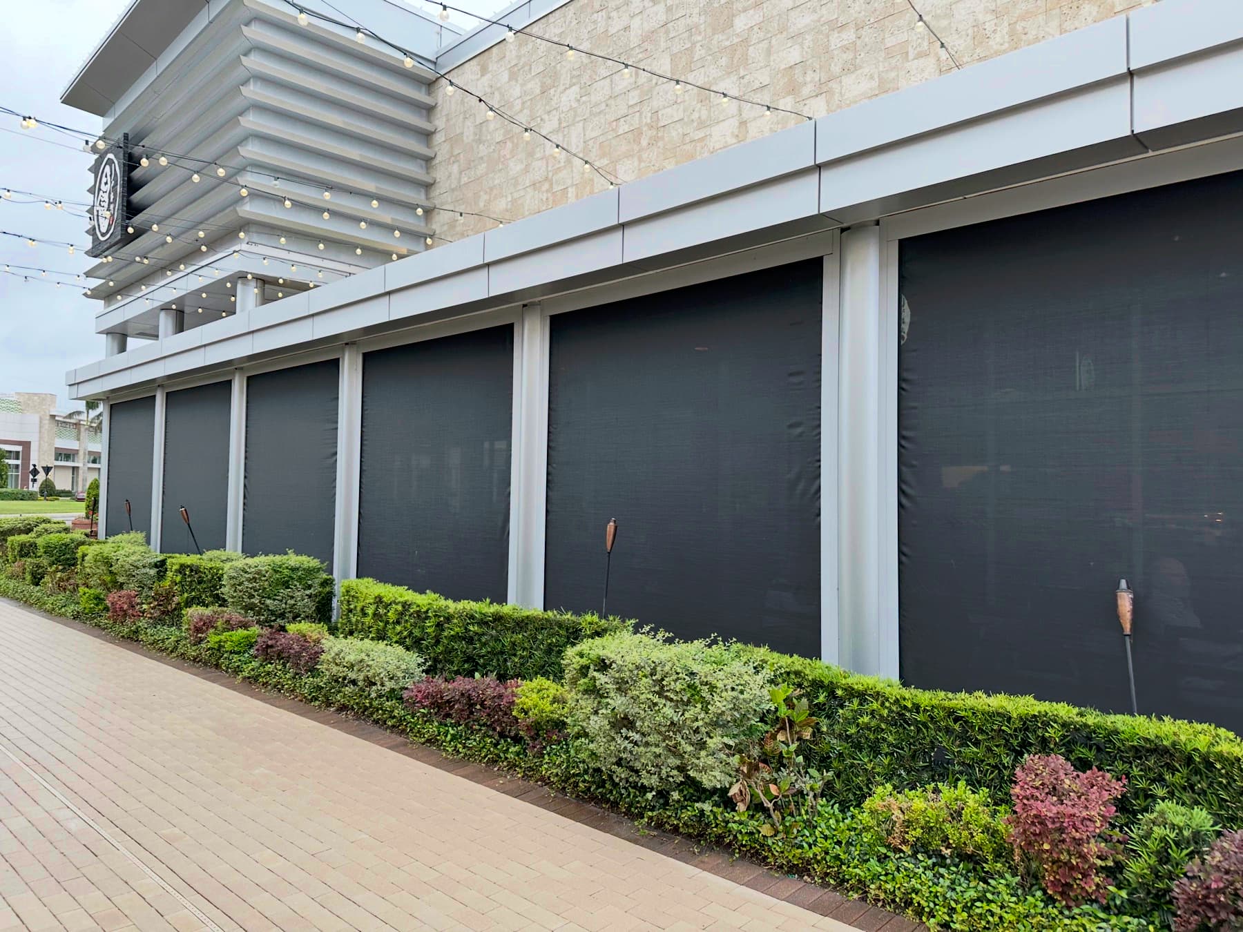 Chicago retractable screen installation on a commercial facade