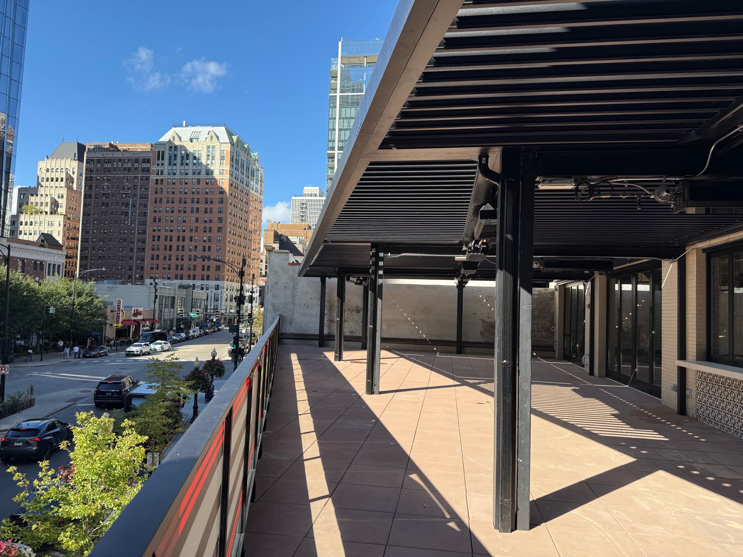 Chicago pergola project with visible city context and outdoor dining