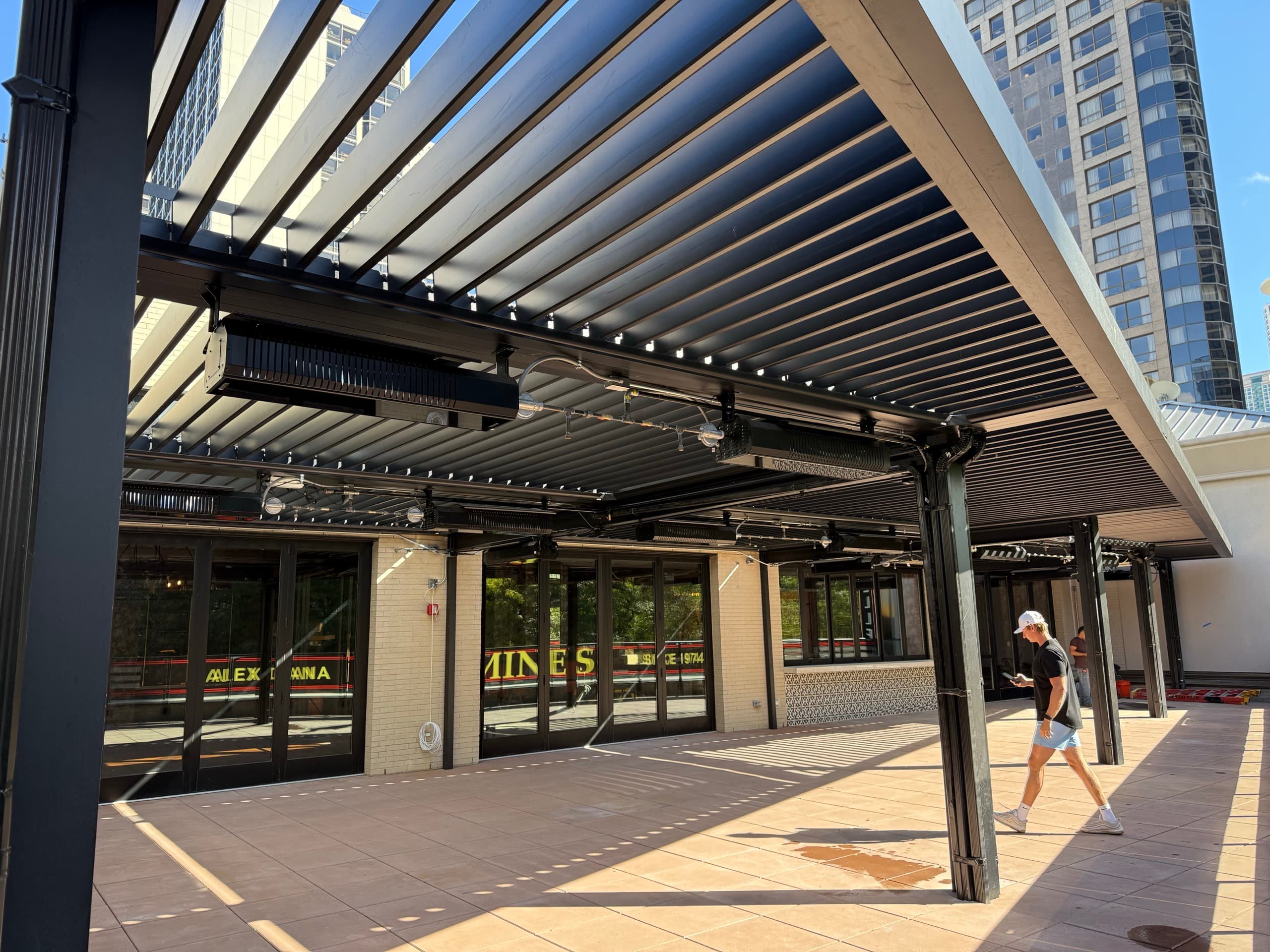 Commercial motorized pergola structure on a Chicago rooftop patio